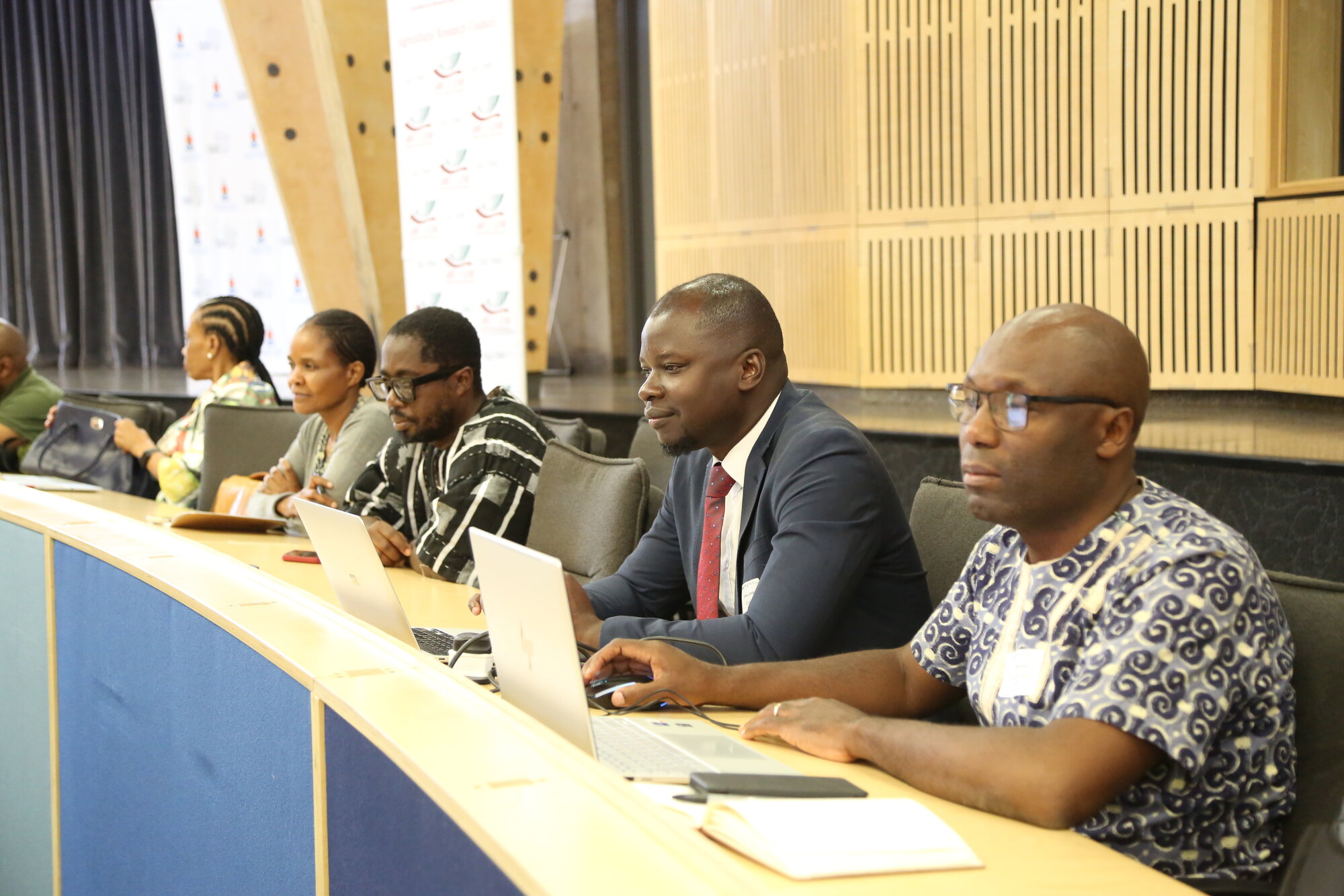 Participants listening to the opening session