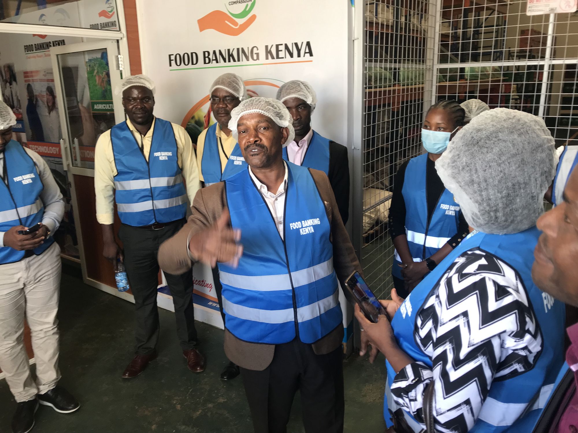 Mr Moses Nyoro and his colleagues from Food Banking Kenya explains the activities of the organisation to the field trip participants.