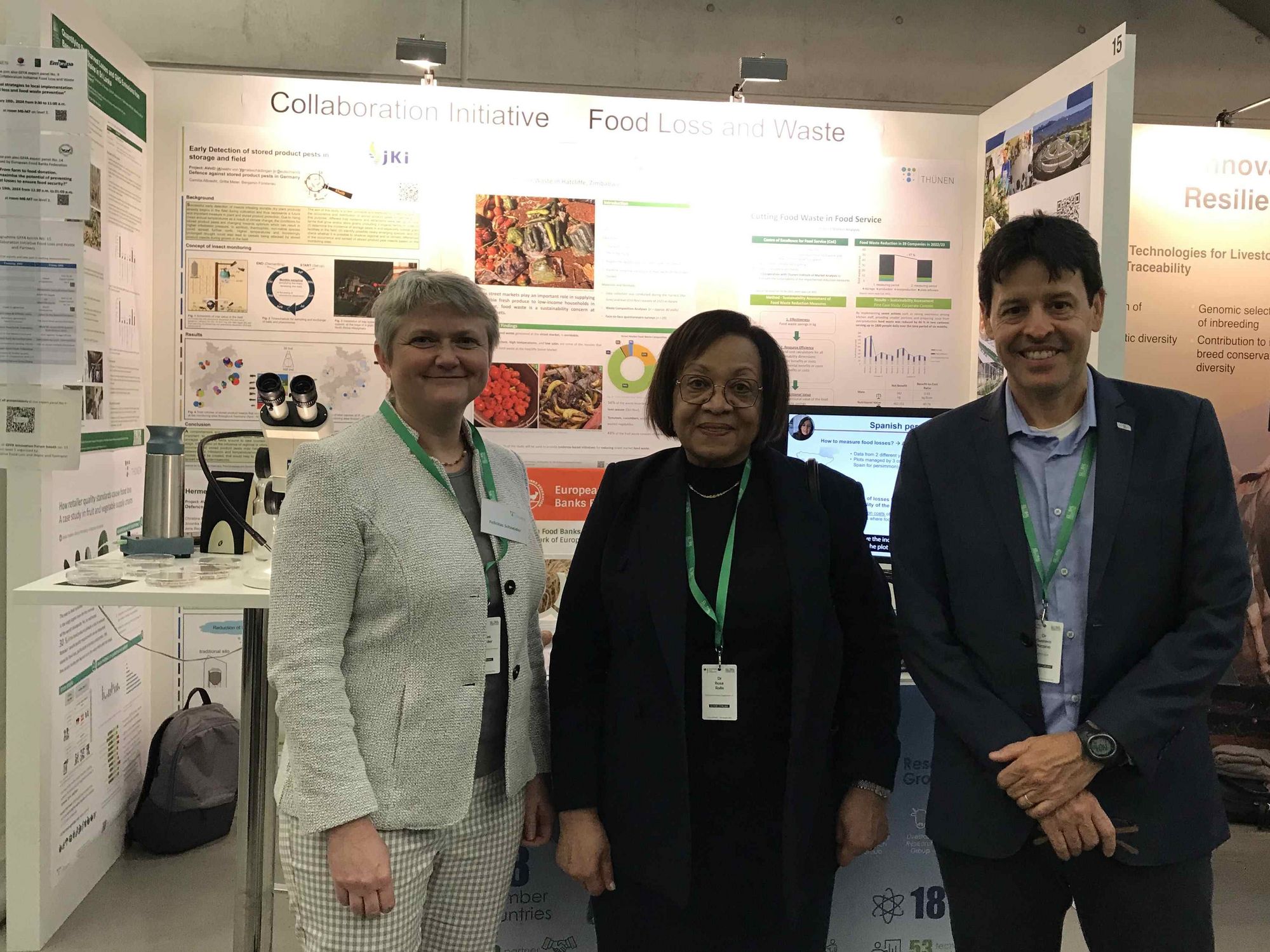 This is a group photos of Felicitas Schneider (coordinator Collaboration Initiative FLW), Rosa Rolle (Food and Agriculture Organisation, FAO), Gustavo Porpino (Embrapa) in front of our GFFA stall.